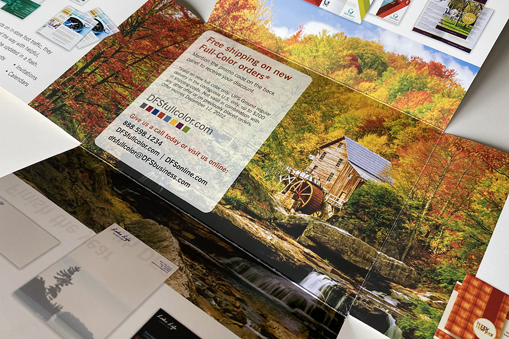 Front cover of a direct mail piece featuring maple leaves in autumn